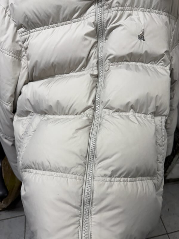 A white suit with stubborn stains brought in for restoration